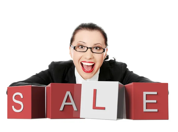 Businesswoman with sale sign — Stock Photo, Image