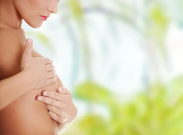 Caucasian adult woman examining her breast — Stock Photo, Image