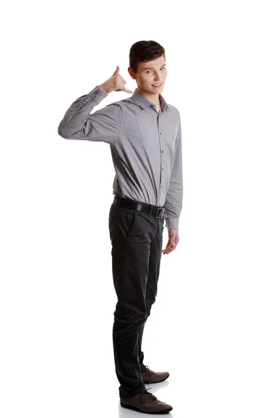 Young businessman showing call me sign — Stock Photo, Image