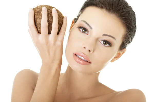 Beautiful woman with coconut in hands — Stock Photo, Image