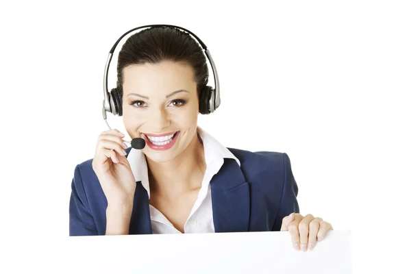 Call center worker holding blank sign board — Stock Photo, Image