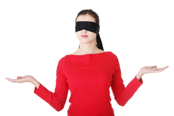 Blindfold woman presenting copy space — Stock Photo, Image