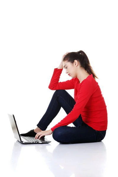 Sad woman looking on laptop screen. — Stock Photo, Image