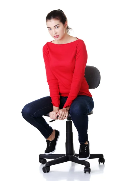 Young happy woman sitting on a wheel chair — Stock Photo, Image