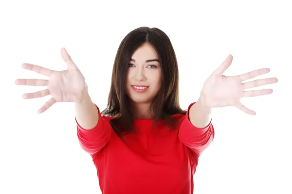 Young woman pointing with both hands — Stock Photo, Image