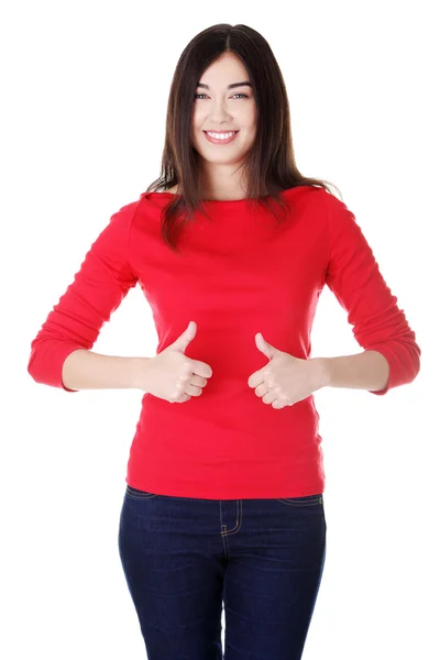 Beautiful young woman gesturing thumbs up. — Stock Photo, Image