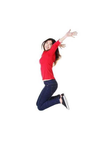 Happy caucasian woman jumping in the air