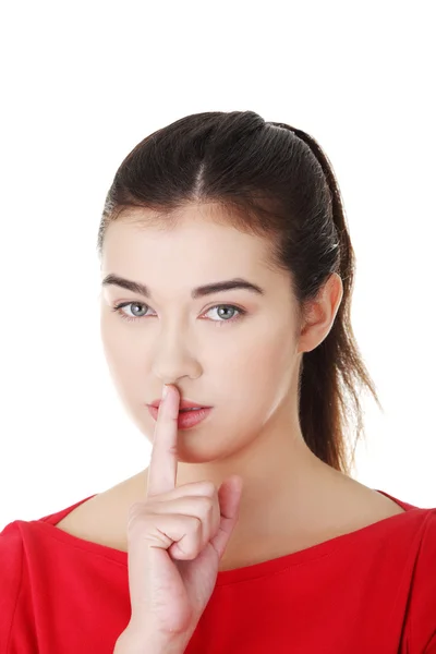 Woman making a keep it quiet gesture — Stock Photo, Image