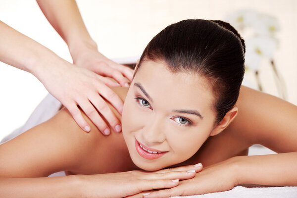 Young woman relaxing in spa saloon