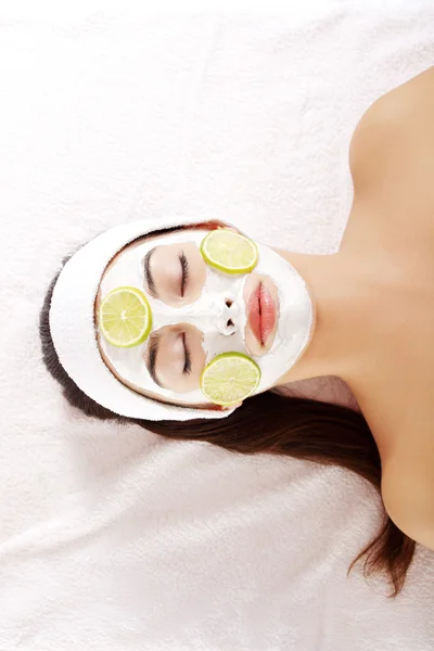 Attractive young woman with fruit mask on a face — Stock Photo, Image