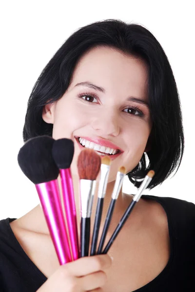 Mladí make-up umělce žena drží štětce — Stock fotografie