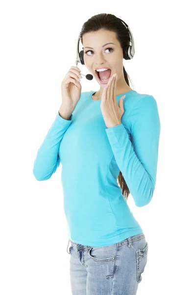 Beautiful young call-center assistant smiling — Stock Photo, Image