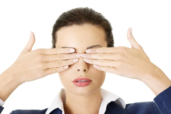 Attractive businesswoman covering her eyes — Stock Photo, Image