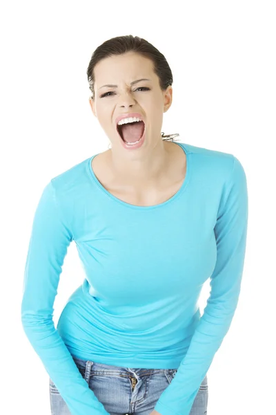 Young casual woman screaming with anger — Stock Photo, Image