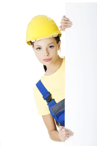 Lavoratrice edile con lavagna bianca — Foto Stock