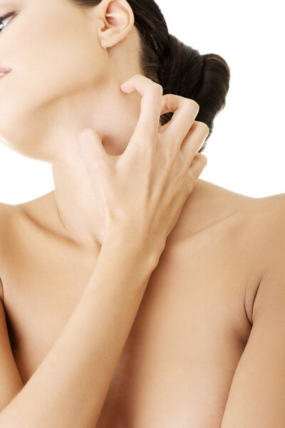 Young beautiful woman scratching her self.