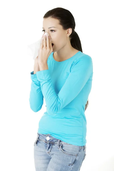 Young woman with tissue - sneezing — Stock Photo, Image