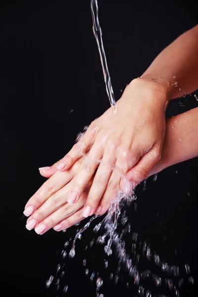 Water falling on female hands — Stock Photo, Image