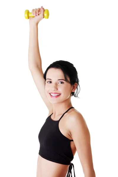 Fitness girl is working out with dumbbells — Stock Photo, Image