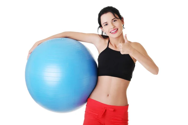 Beautiful young woman with pilates exercise ball. — Stock Photo, Image