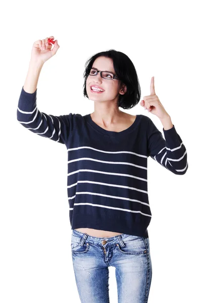 Young student woman writing something — Stock Photo, Image