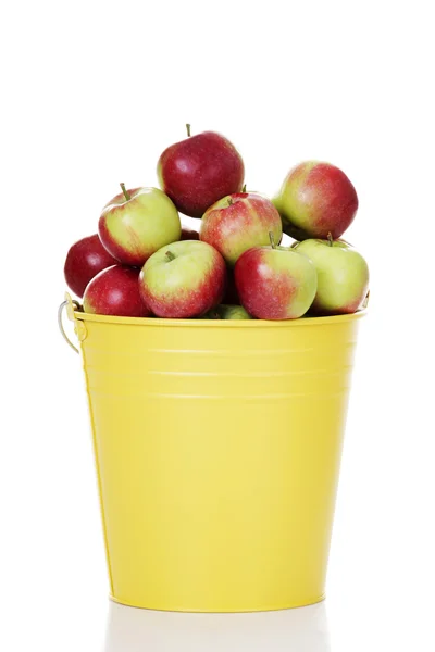 Fresh red apples in yellow bin — Stock Photo, Image