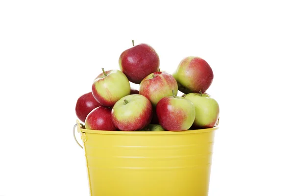 Fresh red apples in yellow bin — Stock Photo, Image