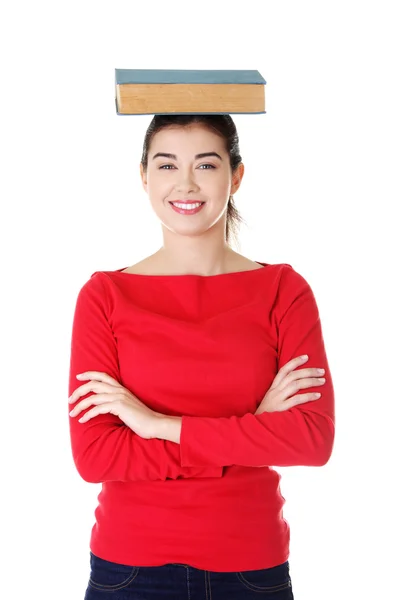 Young caucasian woman with book on her head — Stock Photo, Image