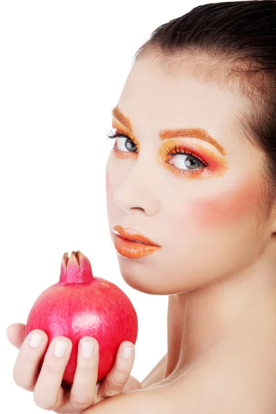 Portrait of young beautiful woman with pomegranate — Stock Photo, Image