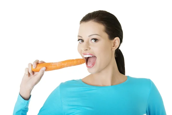 Happy beautiful woman with carrot Royalty Free Stock Images