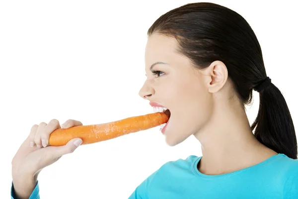 Happy beautiful woman with carrot Royalty Free Stock Images