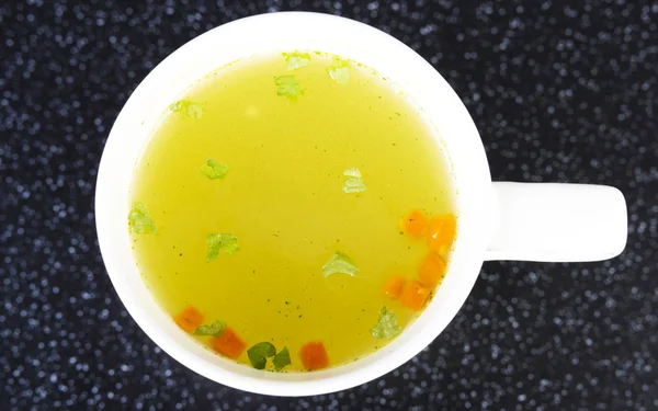 Broth in cup — Stock Photo, Image