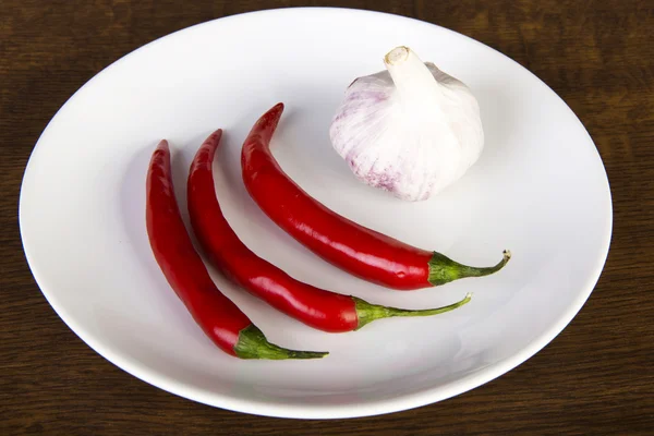 Red chili peppers and garlic — Stock Photo, Image