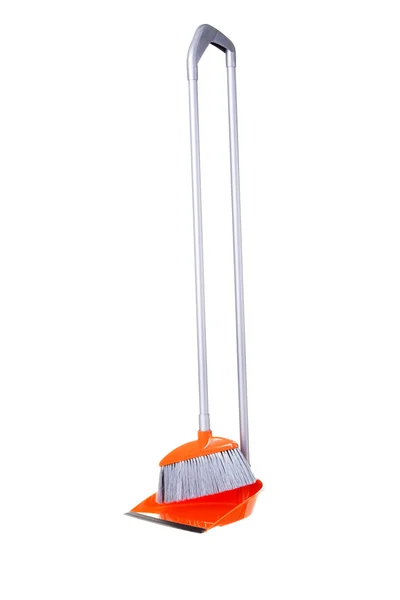 Oranje broom en scoop — Stockfoto