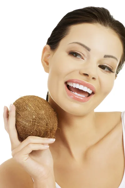 Beautiful woman with coconut in hands — Stock Photo, Image