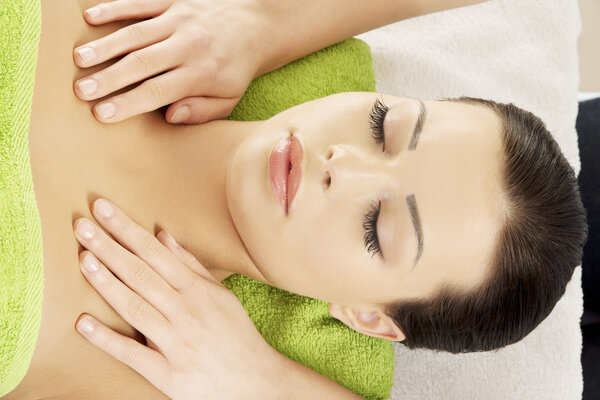 Woman relaxing beeing massaged in spa saloon