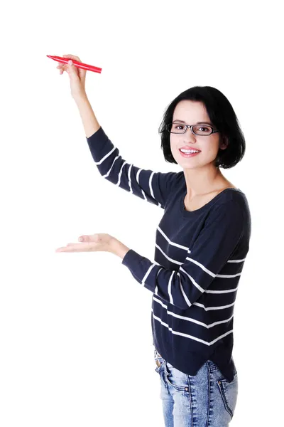 Young student woman writing something — Stock Photo, Image