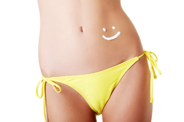 Sexy summeg girl belly with cream — Stock Photo, Image