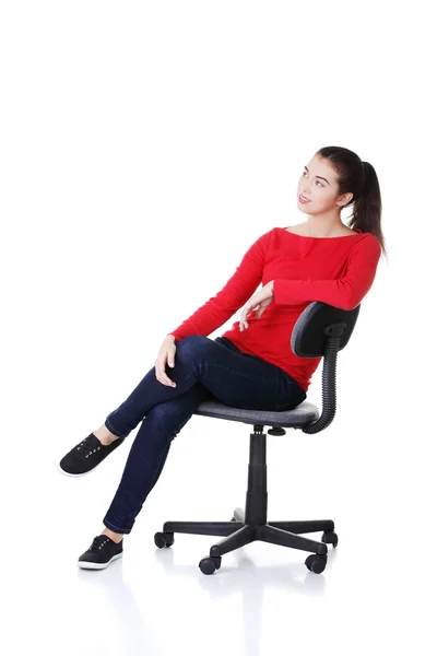 Young happy woman sitting on a wheel chair — Stock Photo, Image