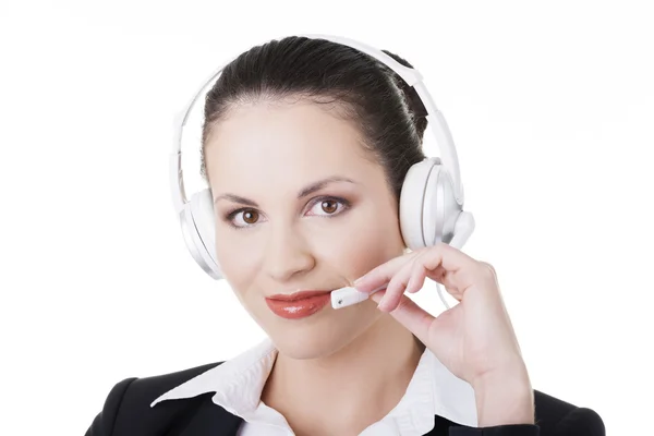 Linda jovem assistente de call center na mesa — Fotografia de Stock