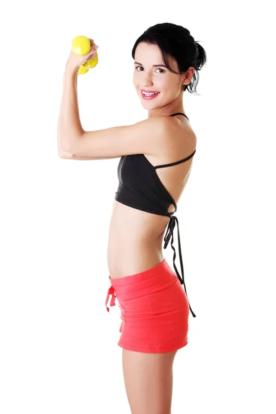 Fitness dívka je cvičit s činkami. — Stock fotografie