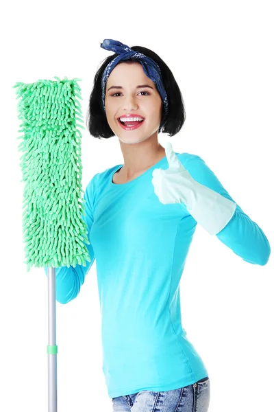 Happy cleaning woman gesturing thumbs up — Stock Photo, Image