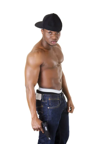 Afro american man standing with gun in hand. — Stock Photo, Image