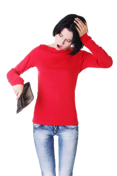 Young woman shows her empty wallet. — Stock Photo, Image