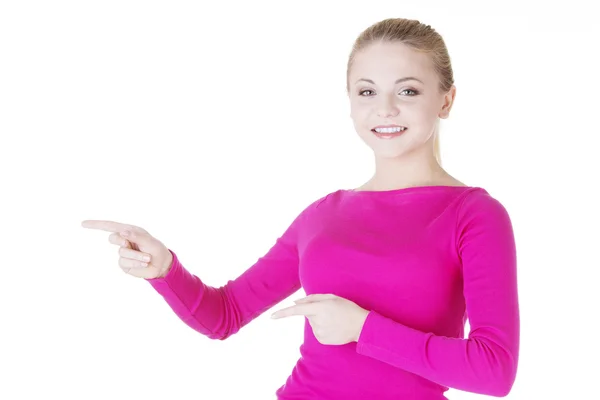 Happy , excited young woman pointing on copy space — Stock Photo, Image