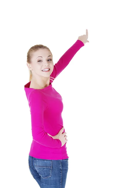 Happy , excited young woman pointing on copy space — Stock Photo, Image