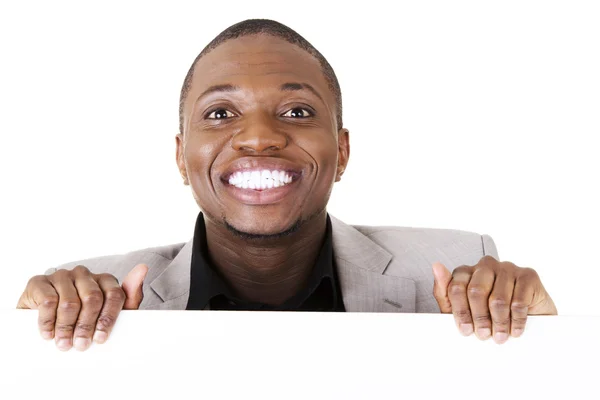 Businessman showing blank advertisement — Stock Photo, Image