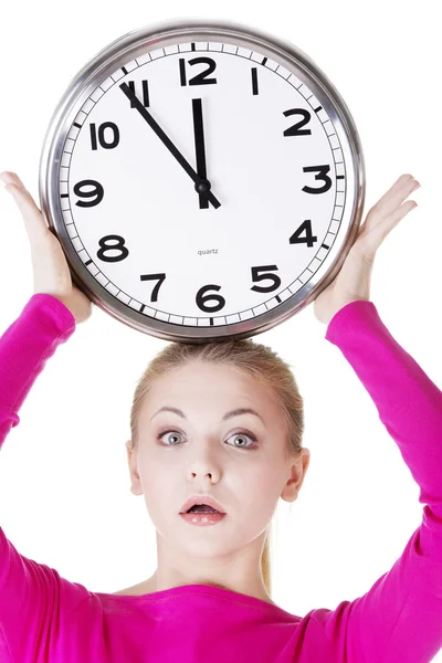 Shocked woman with clock — Stock Photo, Image