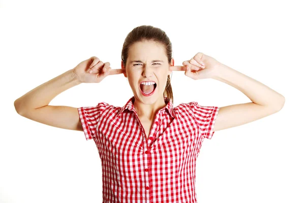 Young angry teen clogging her ears — Stock Photo, Image