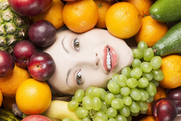 Woman face in fruits — Stock Photo, Image